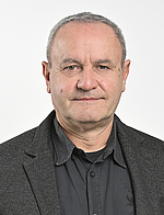 Michael Hufnagl Porträtfoto, © Johannes Zinner ein Mann mit kurzen grauen Haaren und dunklem Anzug